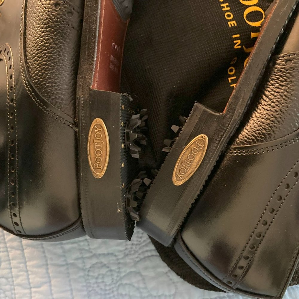 FootJoy men's size 9 1/2E black spike golf shoes, new without tags or box.